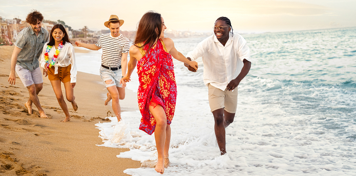 cheerful-friends-running-on-beach-at-sunrise-2026-03-16-23-56-17-utc 1